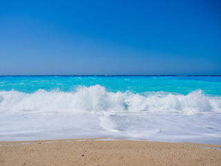 wild beach with rocks in water. Island Lefkada, Greece