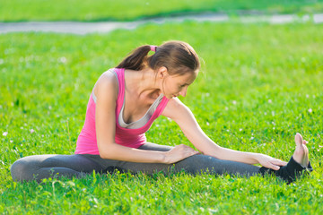 Woman doing stretching fitness exercise. Yoga postures