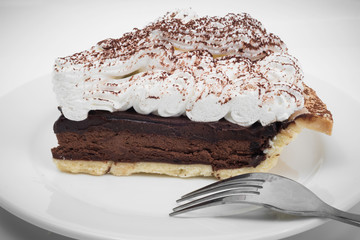 Chocolate tart with fork in white background