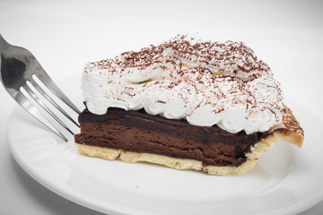 Chocolate tart with fork in white background