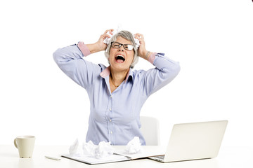 Ellderly woman working with a laptop