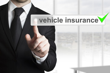 businessman pushing button vehicle insurance