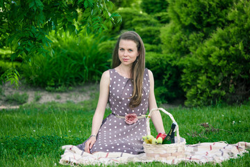 beautiful woman  with basket  on the grass