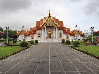 Marble temple under cloudy sky