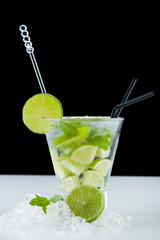 Mojito cocktail with limes and mint