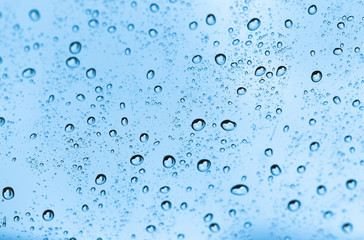 water drops on blue glass