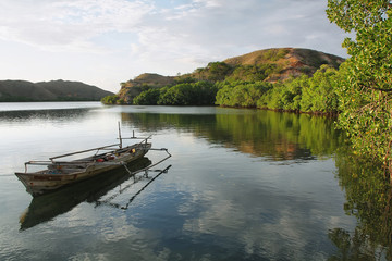 Deserted boat in Rinca island - obrazy, fototapety, plakaty
