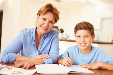 Grandmother Helping Grandson With Homework