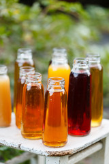 Fototapeta na wymiar different bottles of juice