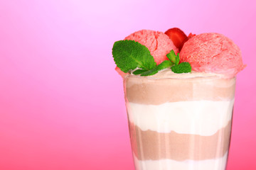 Tasty chocolate mousse with sorbet on pink background