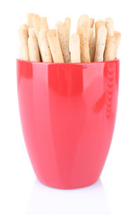 Sticks in red cups on white background isolated