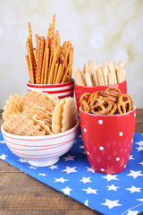 Dry breakfast, sticks and biscuits in red polka dot cup and