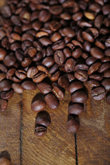 Coffee beans on rustic wooden background