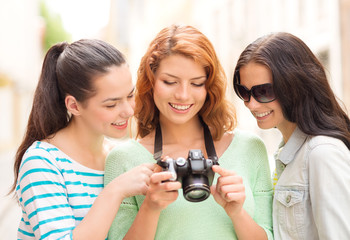 smiling teenage girls with camera