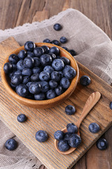 Wooden bowl of blueberries
