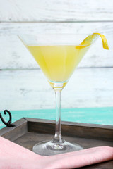 Melon smoothie in glass on table on wooden background