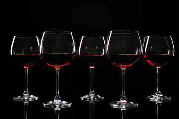 Glasses of wine isolated on black