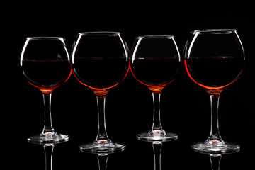 Glasses of wine isolated on black