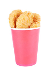 Fried chicken nuggets in cup isolated on white