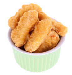 Fried chicken nuggets in bowl isolated on white