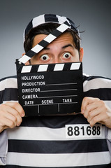 Inmate with movie clapper board