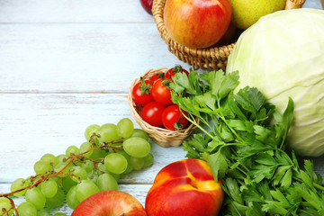 Fototapeta na wymiar Fresh organic vegetables and fruits on wooden background