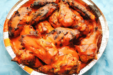 Spicy Hot Buffalo Wing Pieces in a Takeout Container