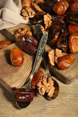 Tasty dates fruits on wooden table