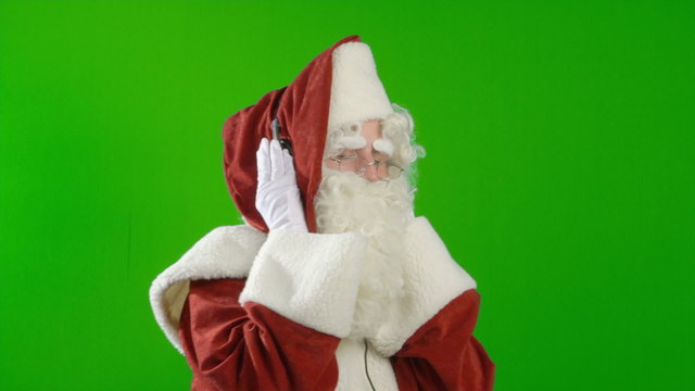 Santa Claus with Headphones - Listening to Music