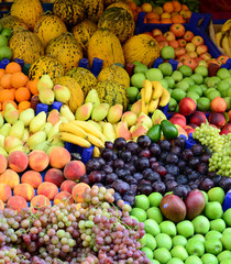 Market with various colorful fresh fruits and vegetables
