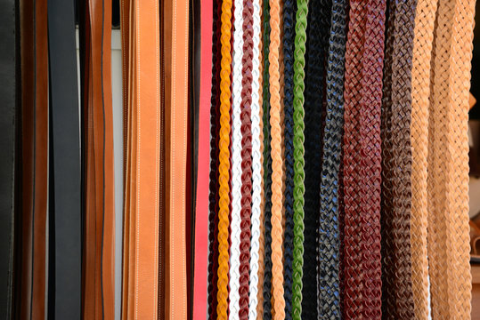 Pile of colorful leather belts