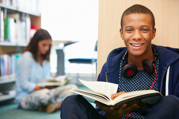 Two College Students Studying In Library