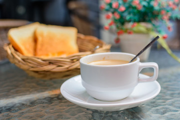 Cup of coffee with bread