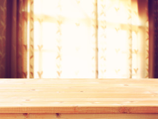 empty wooden table and window light background  filtered image