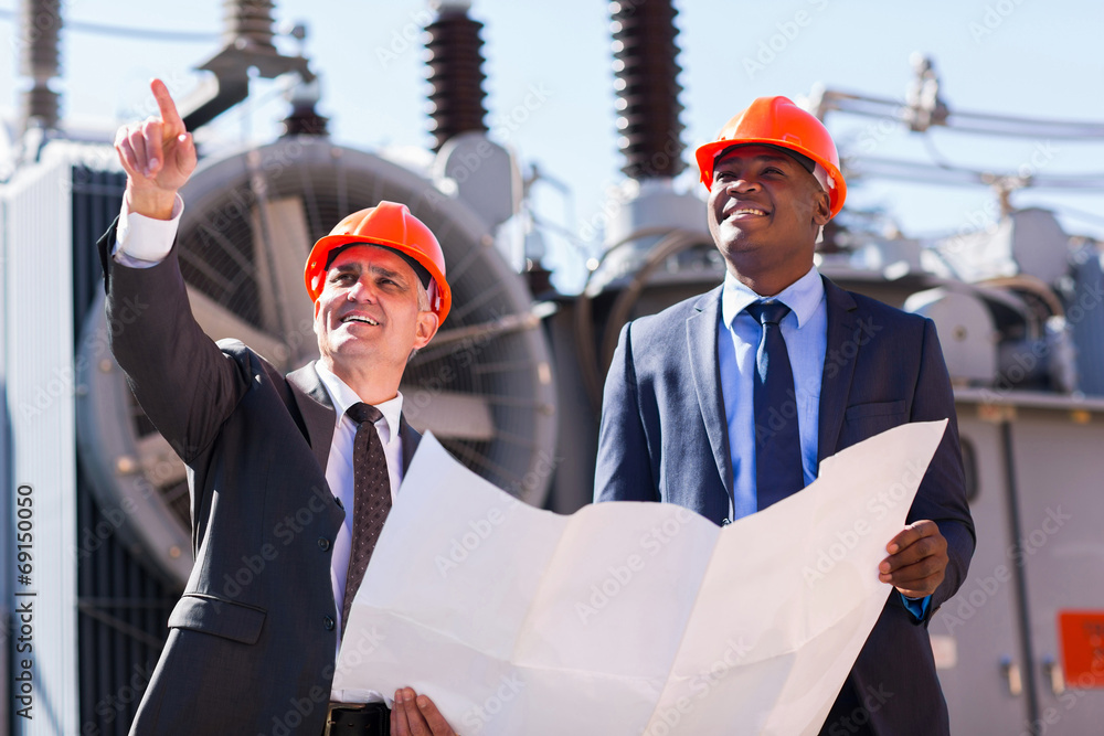 Wall mural managers working in electrical substation