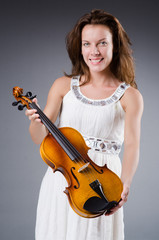 Woman artist with violin in music concept