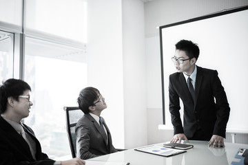 businessman giving a presentation to his colleagues