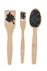 Wooden spoon, fork, paddle with sunflower  seed