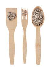 Wooden spoon, fork, paddle with sunflower  seed