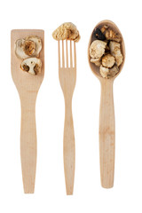 Wooden spoon, fork, paddle with  mushroom