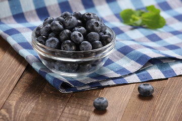 Fresh blueberries in a glass bowl