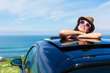 Relaxed woman on summer car vacation travel