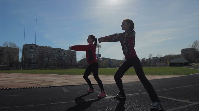 Young girls spend training exercises before the race