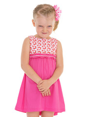 Cheerful little girl smiling on a white background.
