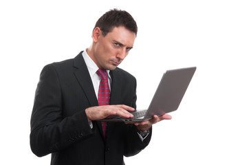 Portrait of young businessman with laptop