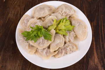 ravioli in a white plate on the table