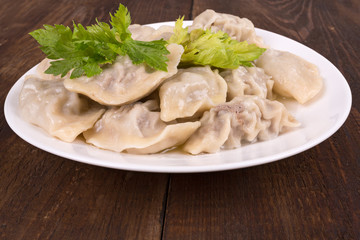 ravioli in a white plate on the table