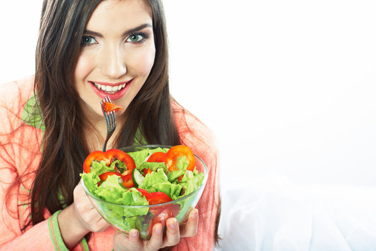 Young woman eat salad. Healthy vegetarian food.