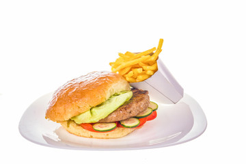 hamburger with salad and french fries isolated on white plate