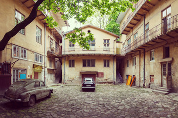 vintage car and old courtyard of the city Lviv